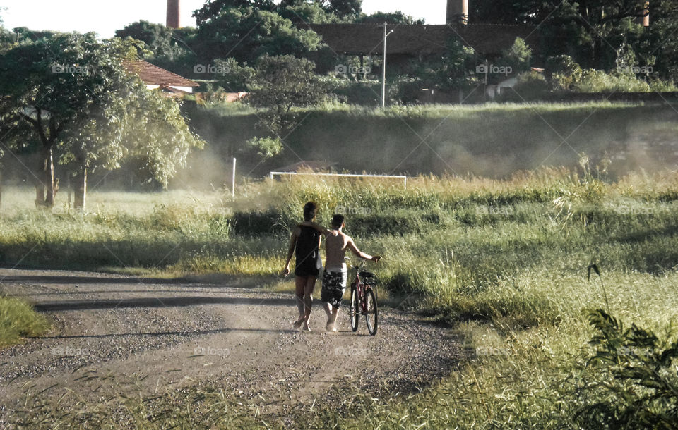 Two people in a road.