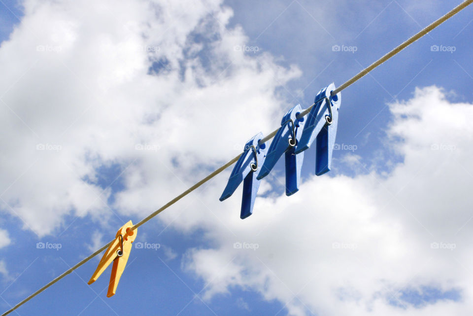 Colorful clothespin and sky