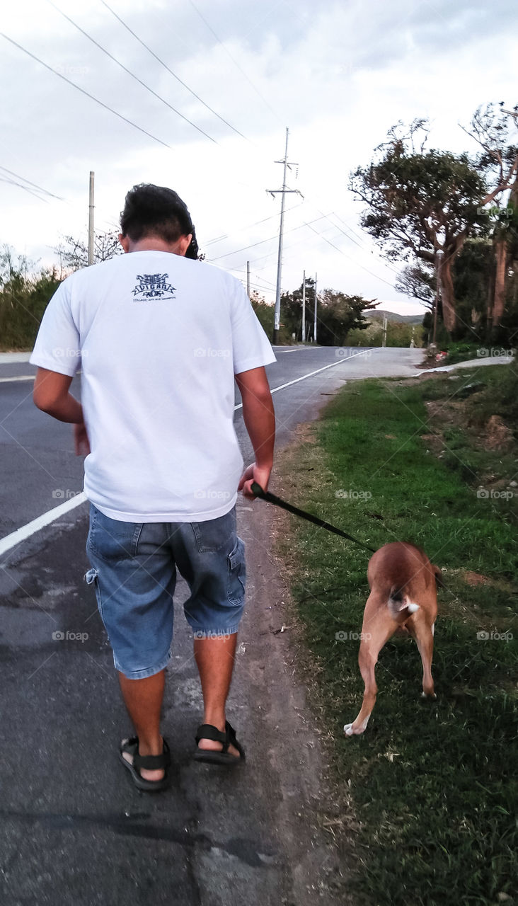 Walking on the side of the road is our common exercise everyday. This keeps us healthier as time passes by. Living with a four-legged friend, makes a persons life longer.