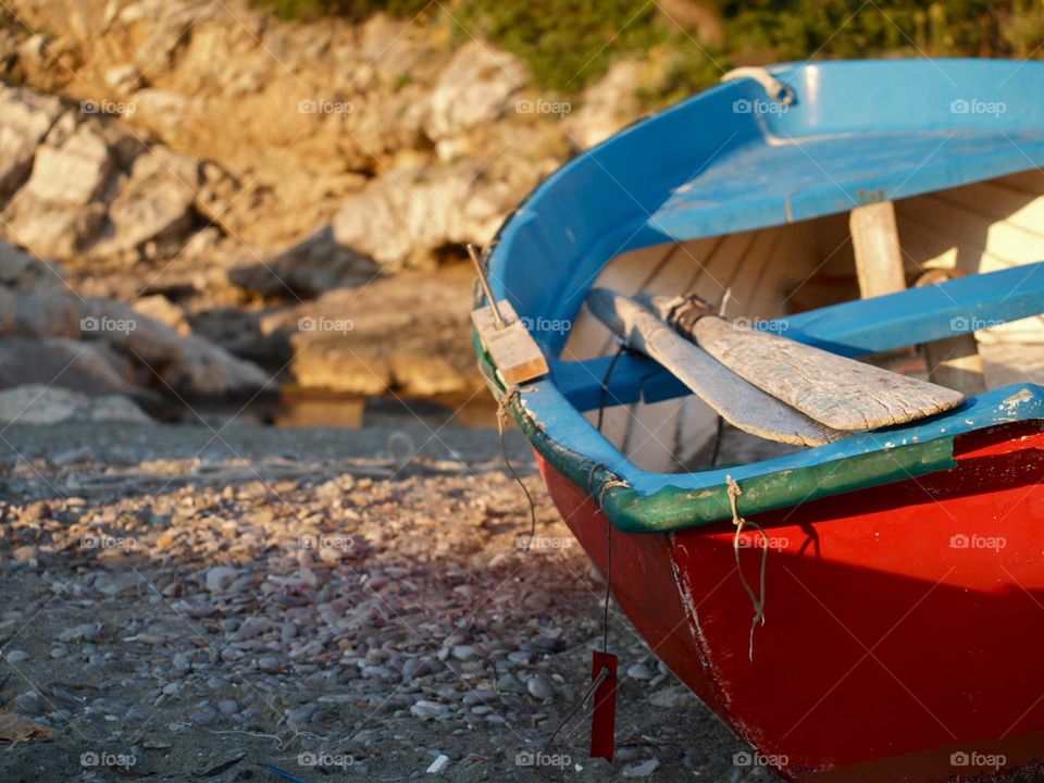 colorful boat moored on the beach