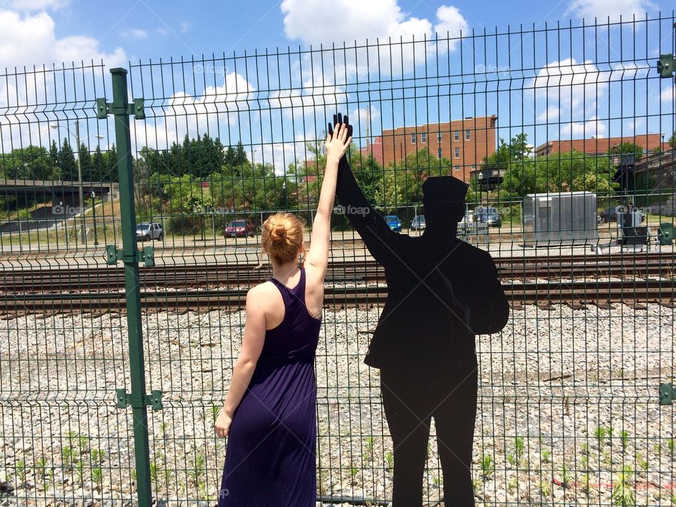 High Five. K Bruce (model) giving a rail conductor silhouette a high five