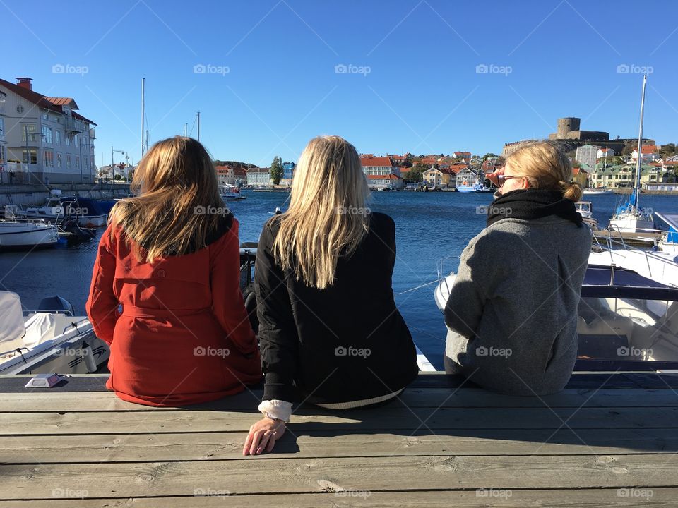 girls overlooking the sea