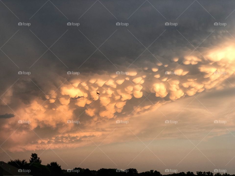 Mammatus storm clouds during a Kansas sunset.