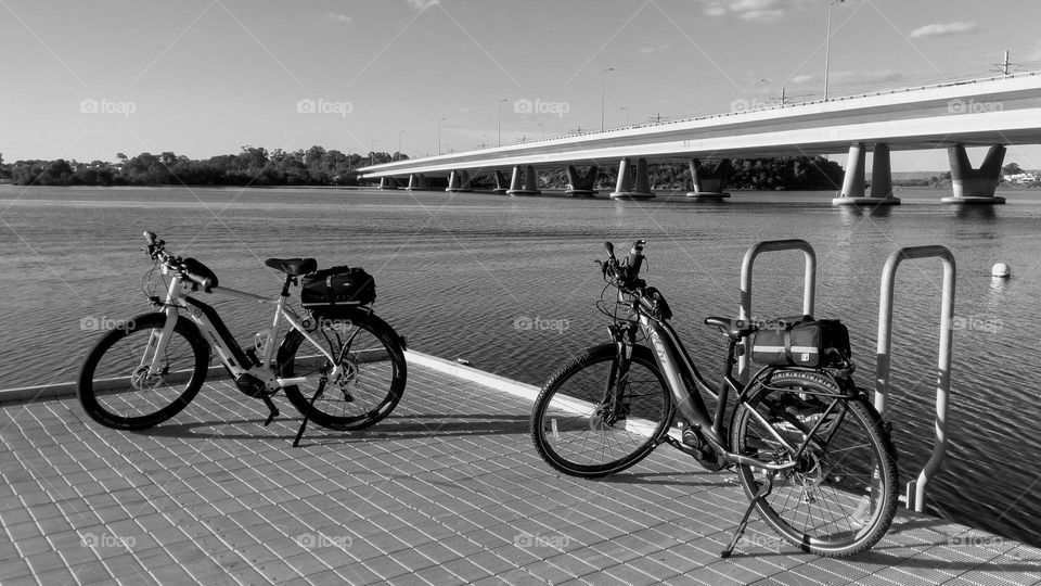 Parked bicycles with riverside views!
