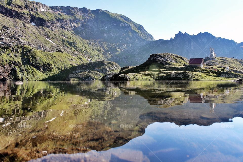 Reflection of mountain on idyllic lake
