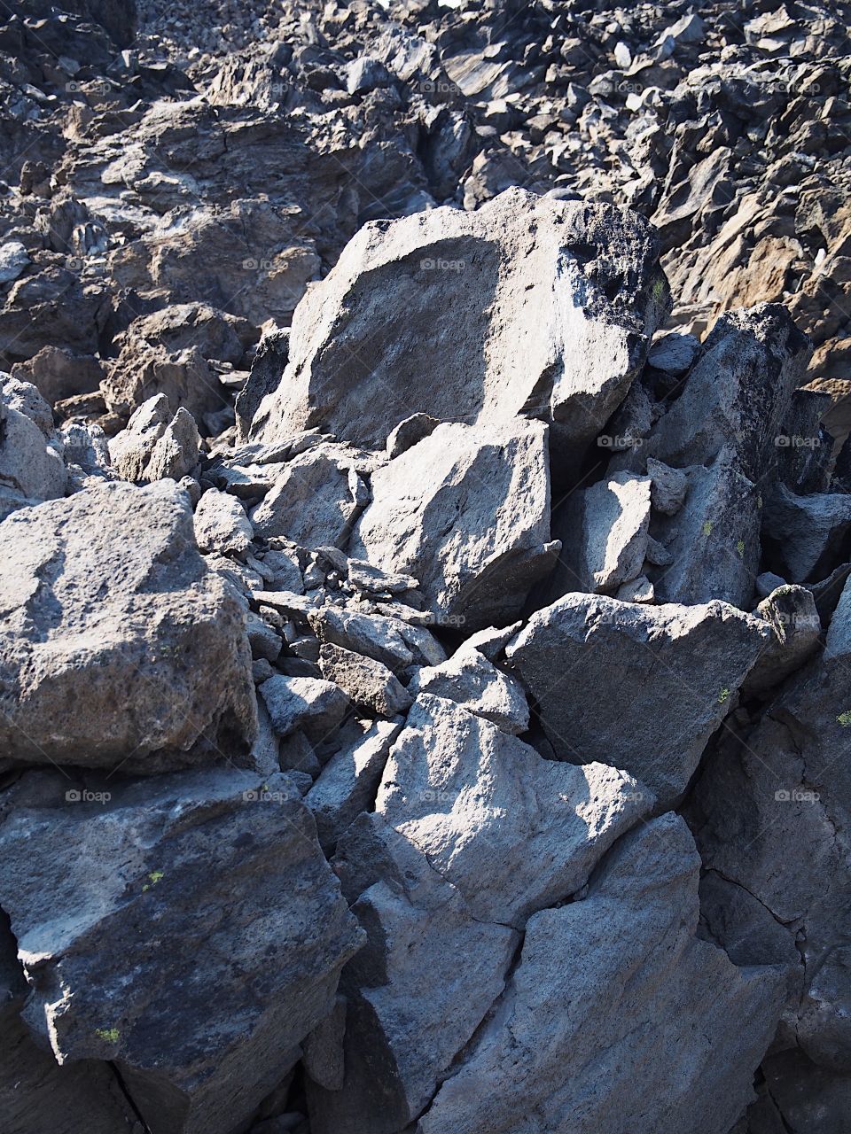 The rugged terrain of the jagged rocks at the Big Obsidian Flow in the Newberry National Volcanic Monument in Central Oregon in the fall. 