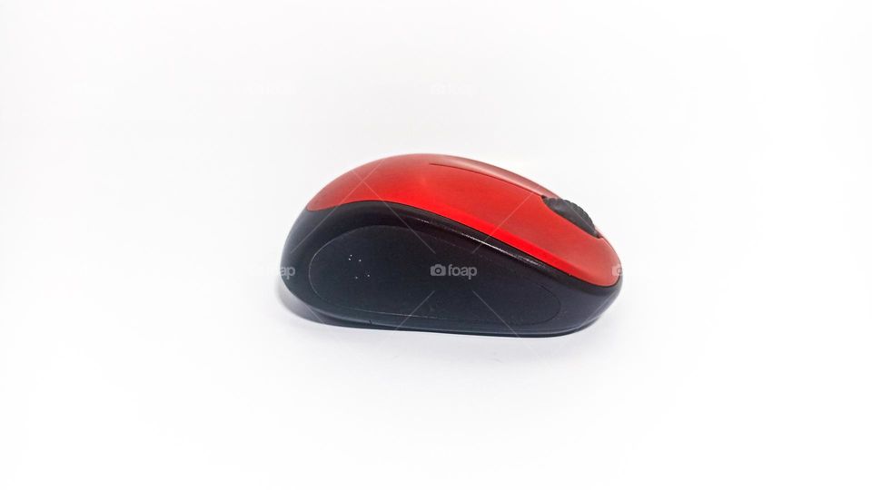 Red computer mouse on white background isolated in eye level view