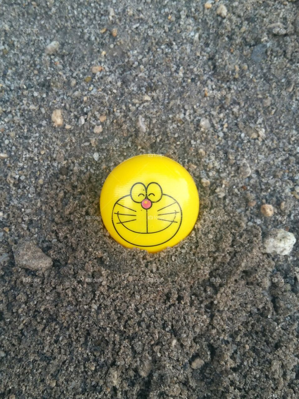 Doremon toy in the sands...