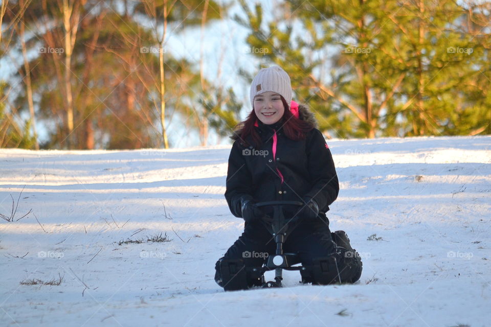 Girl sledding 