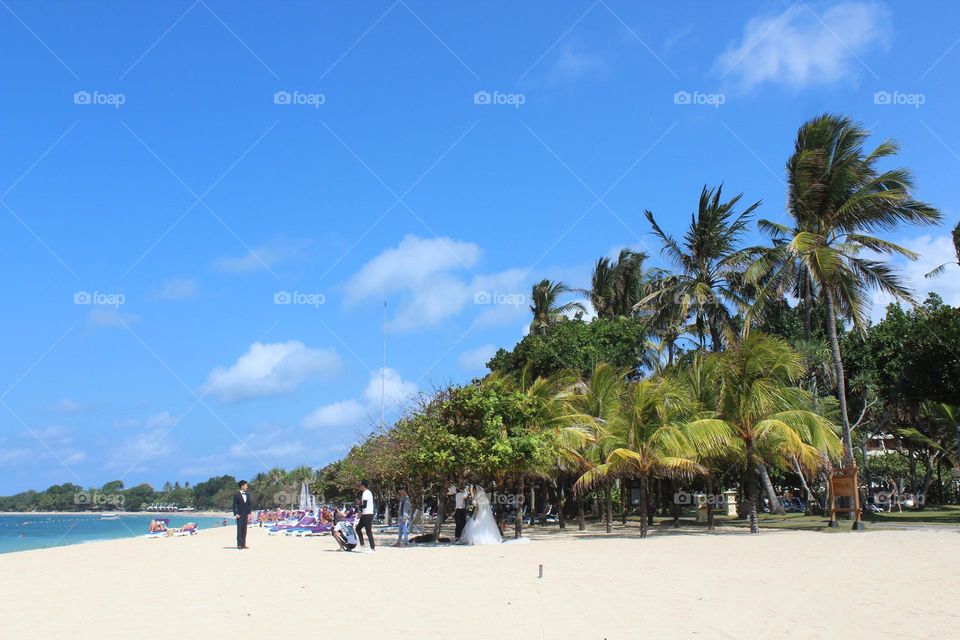 Wedding celebrations and photo-opts in Nusa Dua resort coastline area of Bali island. 