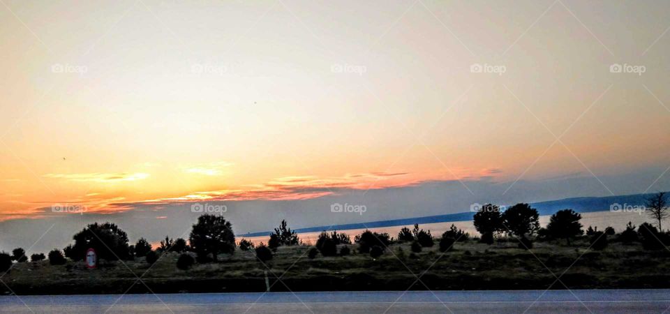 sunrises, sunsets and the moon: sunset over the sea(looking from roadside)