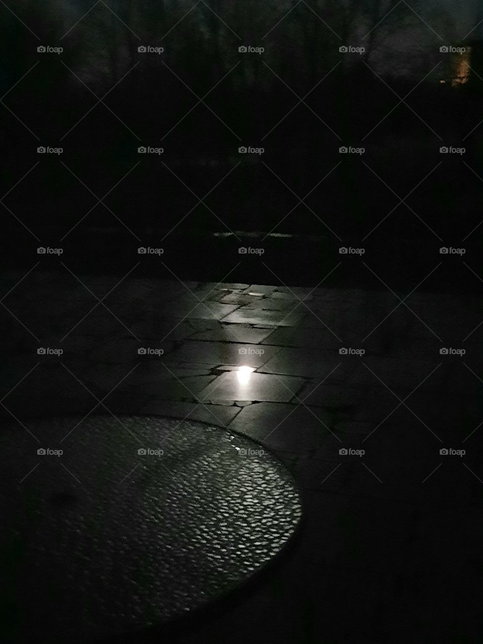 moon light reflections  on stone pavement and glass table