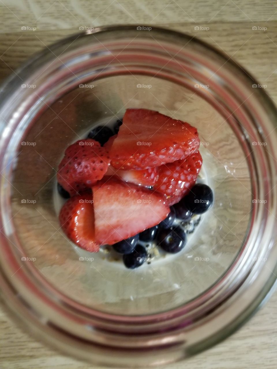 Breakfast in a Mason Jar. Overnight oats with berries,  almond milk and chia seeds.