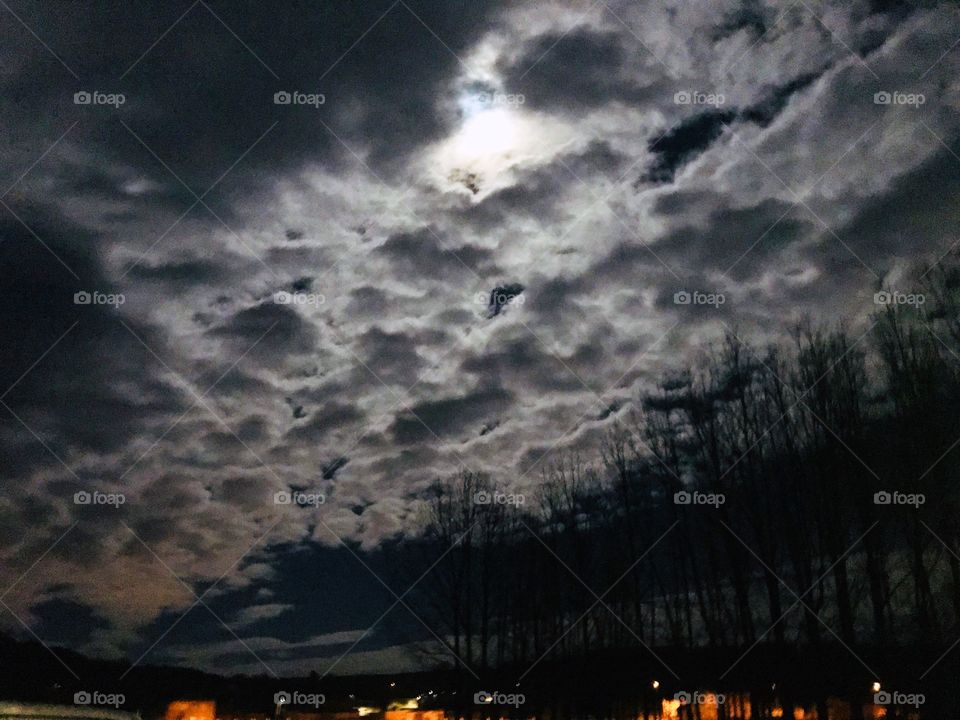 The moon under the Clouds. Happy dreams, incredible skies