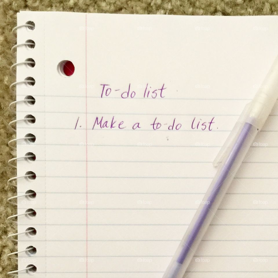 Hand-written on paper to-do list of New Year’s resolutions
