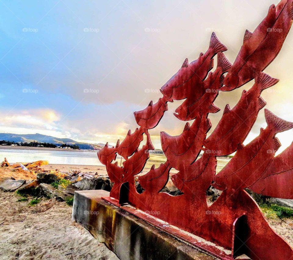 Copper Statue of Salmon and Pretty Sunset "This Way"