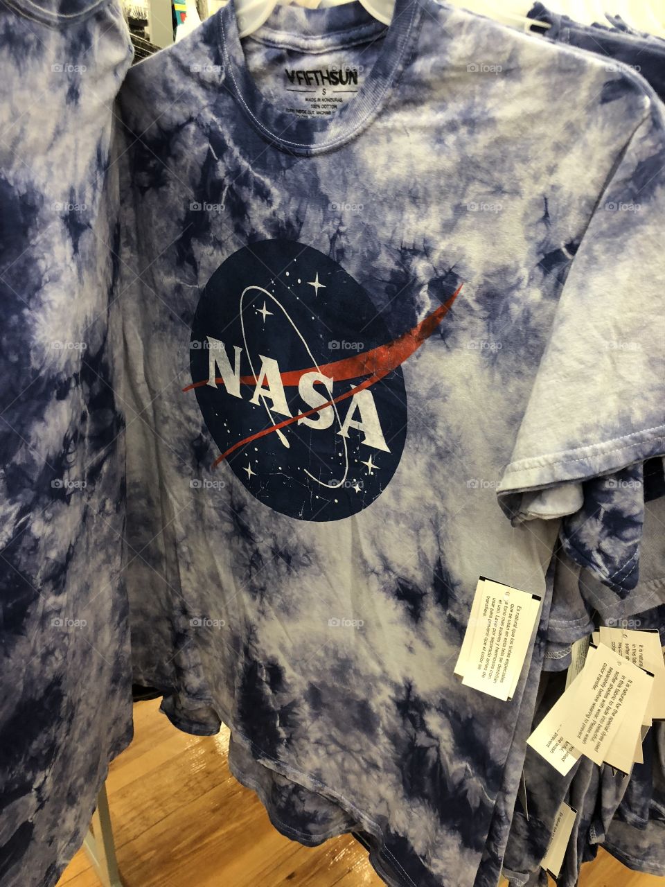 Picture of a tie dye NASA shirt.