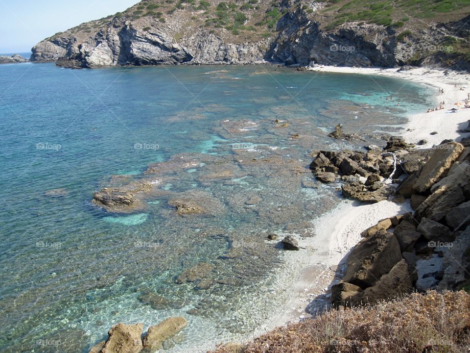 cliff And White Sandy beach in the mediterranean sea