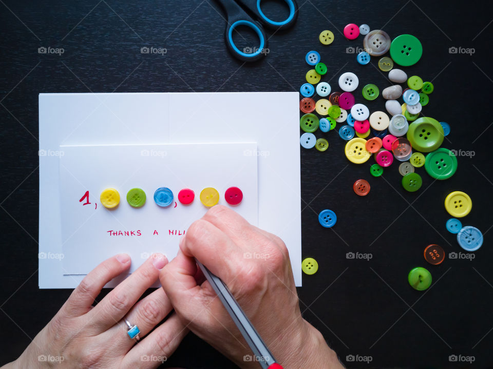 Creating a Thank You card from colorful buttons . Thanks a million.