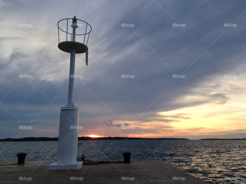 sunset sea croatia lighthouse by igor.zikovic