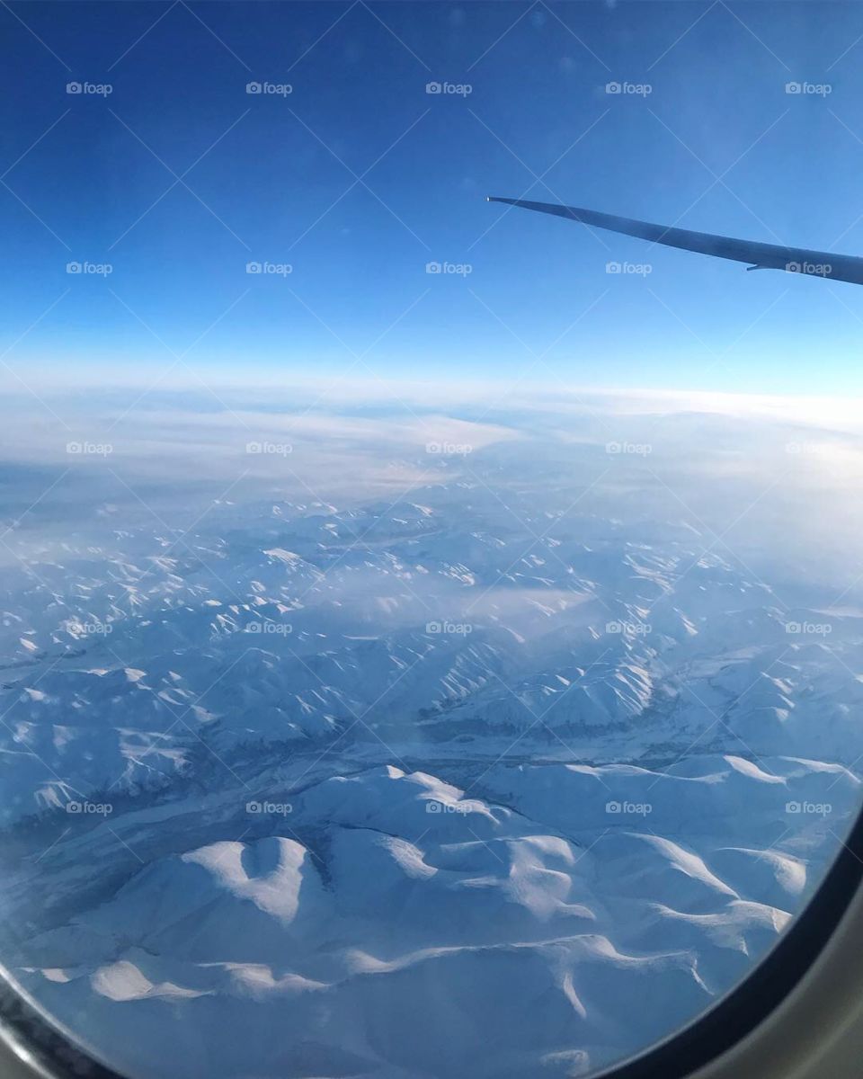 Above snowy mountains