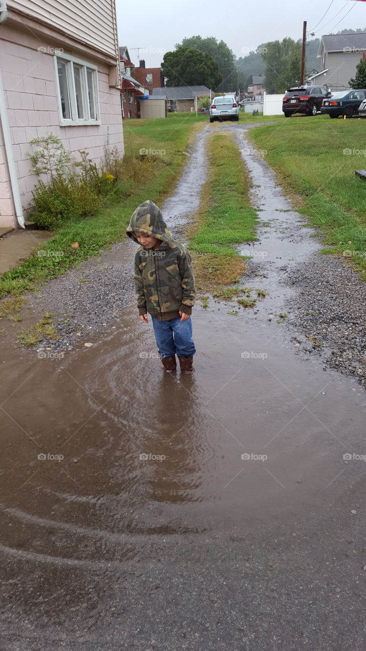 boy in puddle