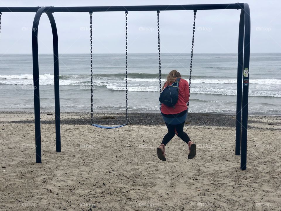 Girl on a Swing set at the ocean!