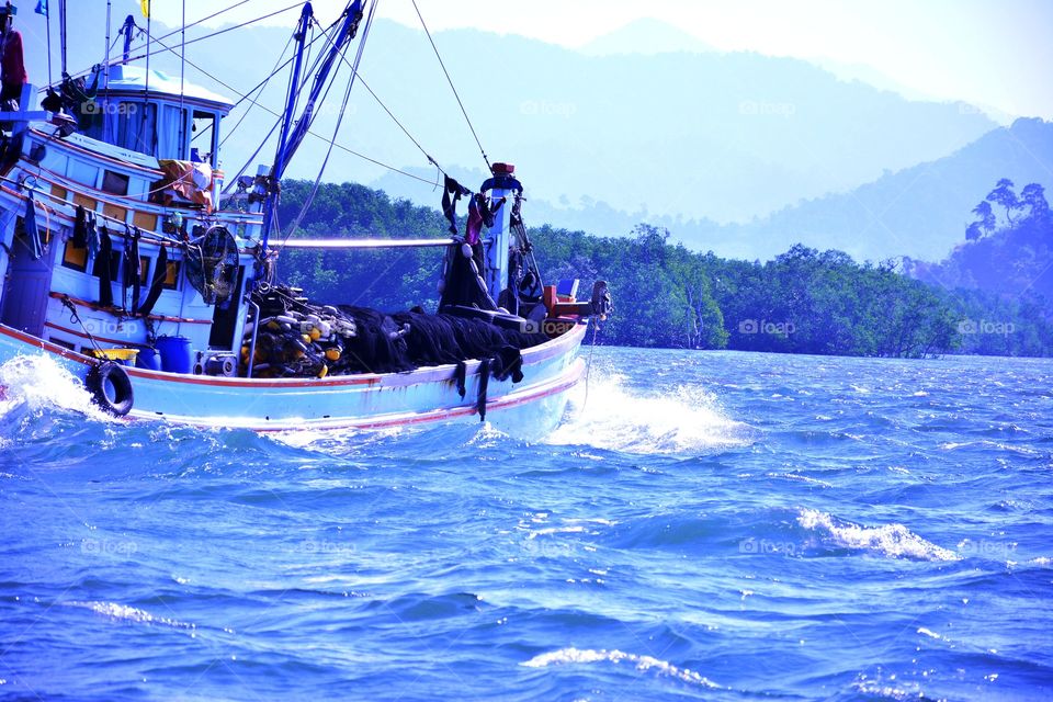 A fishing boat who earns a living at sea