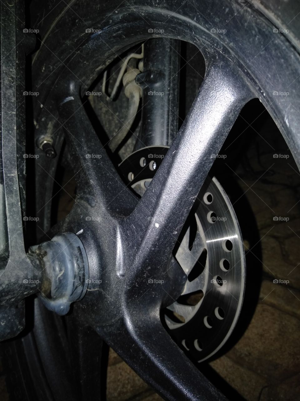 The motorcycle uses star wheels and disc brakes that are so dashing