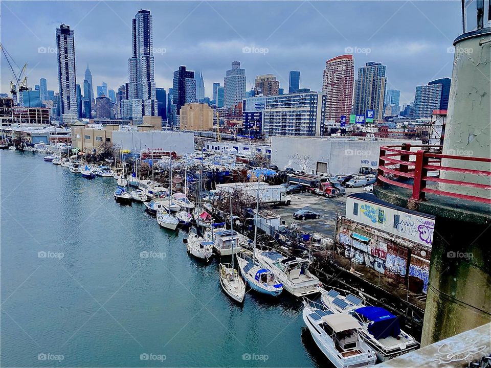 The best thing about living here at “Newtown Creek” in LIC, Queens are the photos opportunities. The arial shots from the bridge are often phenomenal. In the far distance you can see the “Manhattan” & LIC skylines. 2023. Hypnotic Productions