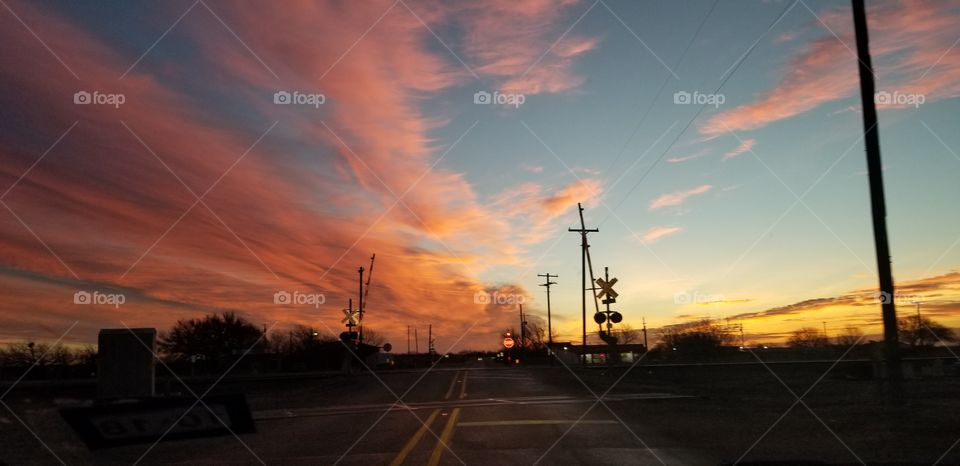 Railroad crossing in the sunrise