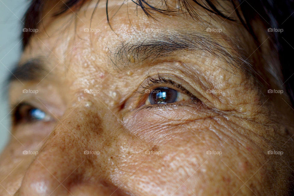 Portrait of old lady looking forward - close up eyes