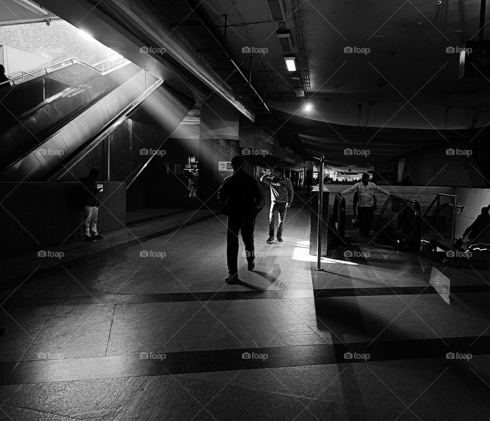 black and white picture of metro station in delhi.
