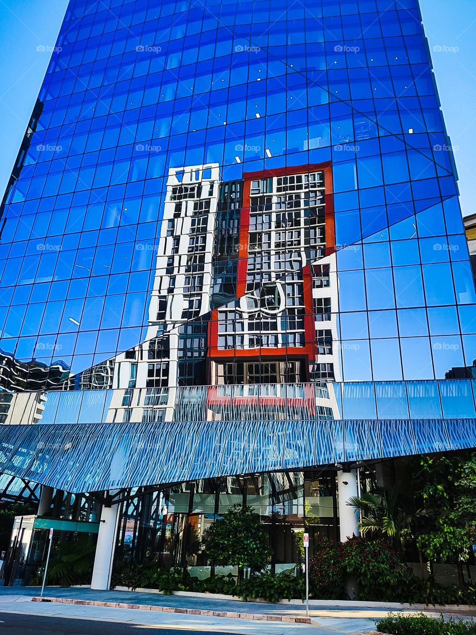 Reflection of a building in the window facade of another building