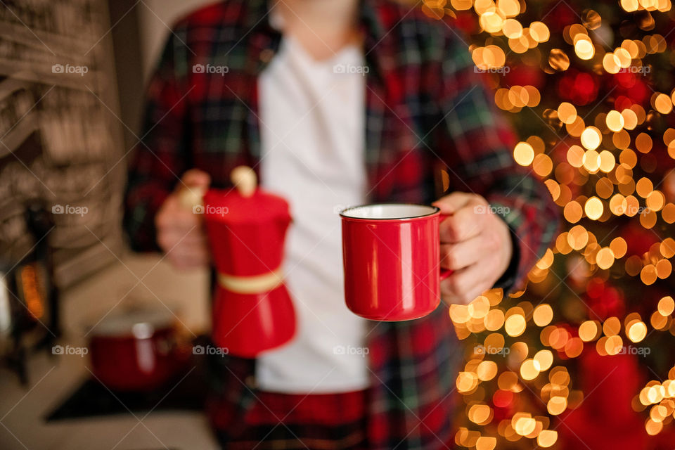 cup of coffee in a cozy festive Christmas atmosphere