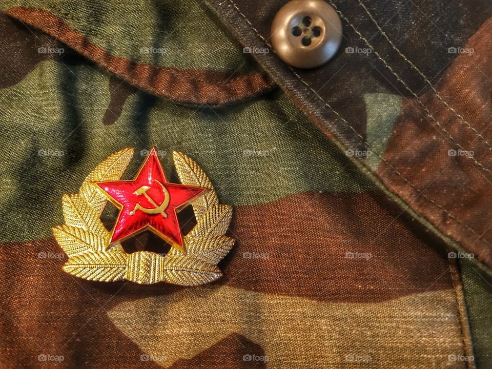Communist hammer and sickle badge