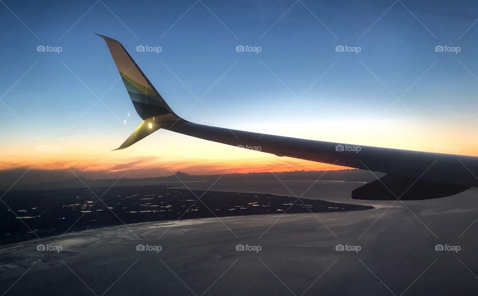 Incredible aerial view of an Alaska sunset and the Cook Inlet from commercial flight. 