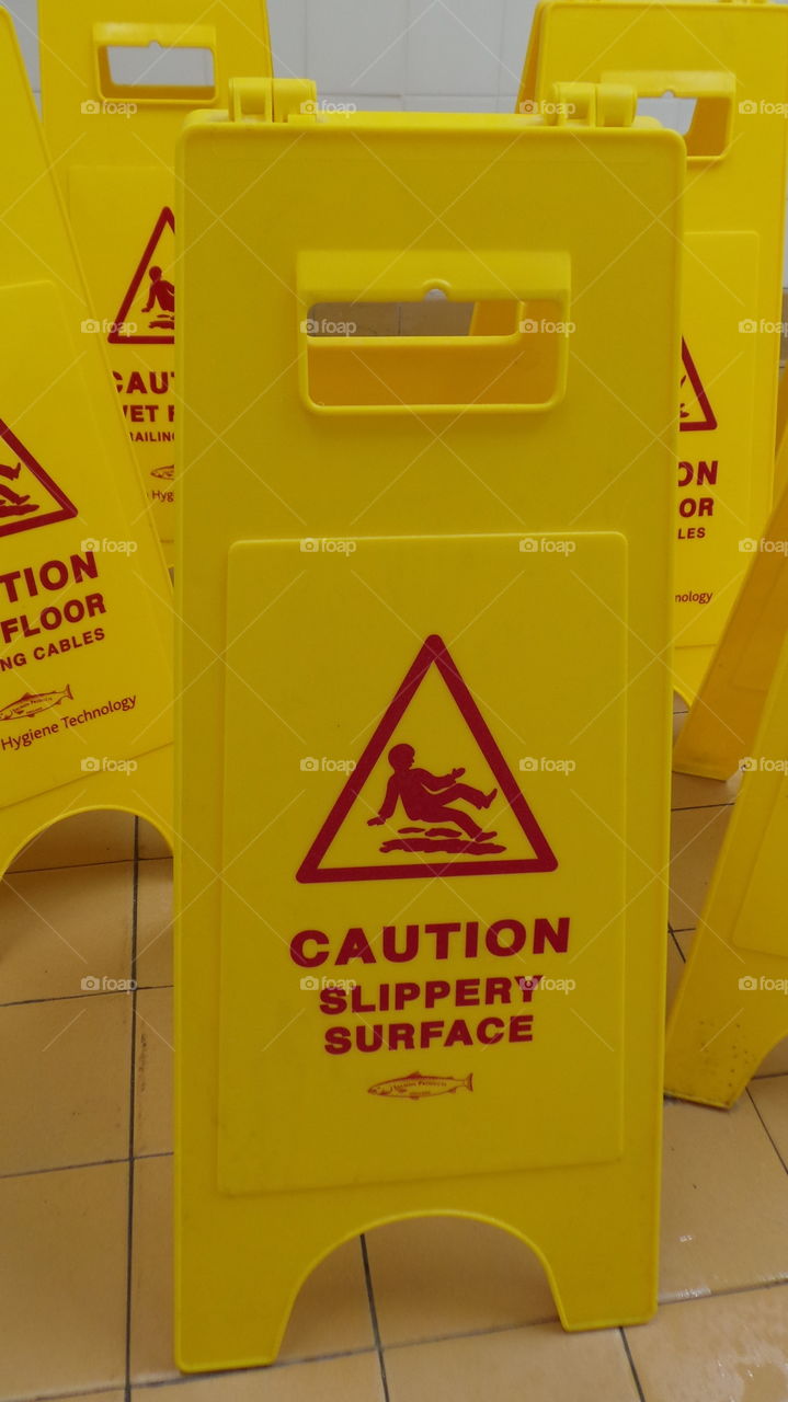 many hazard signs
slippery floor warning