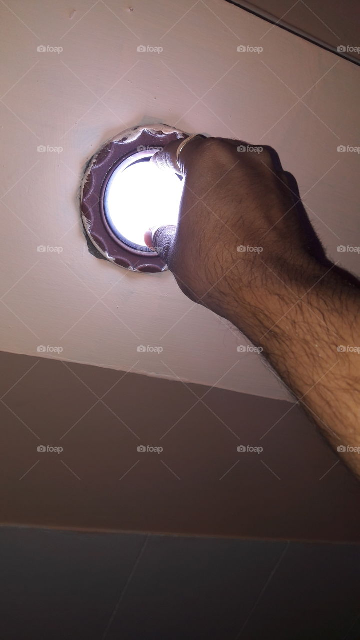 Fixing the led bulb in the socket. LED bulbs had helped in reducing electric consumption to a great level. This has also helped in reducing carbon emissions.  By the help of technology we can greatly reduce Global warming.