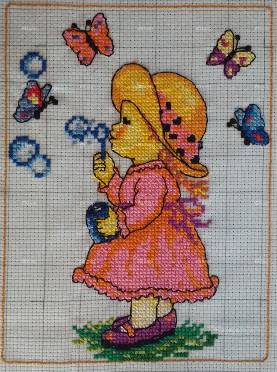 cross stitch small girl playing