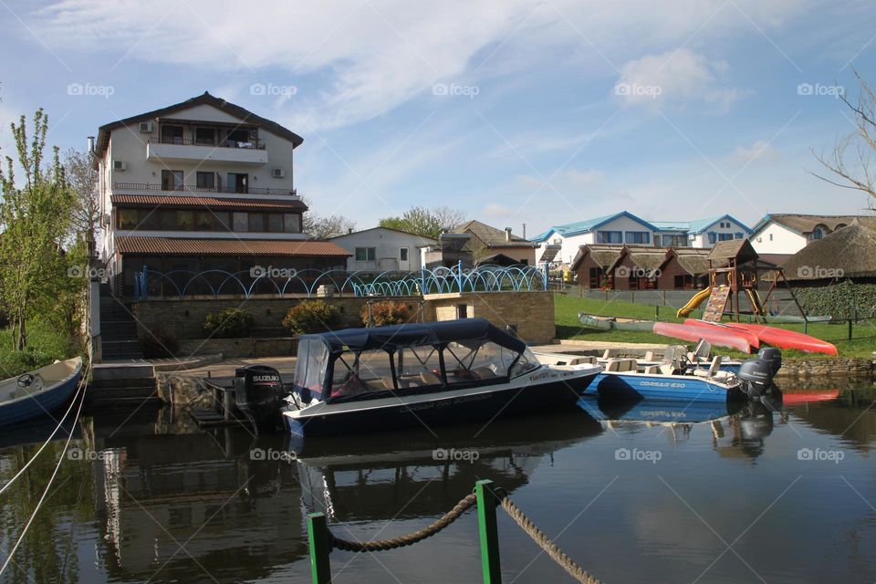 House and boat's reflection