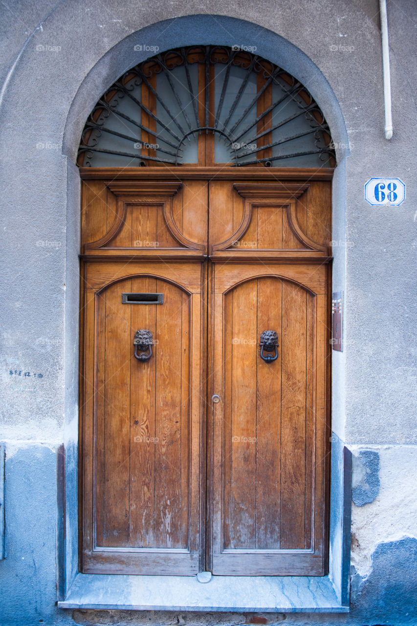 Old door in the city of Cefalu on Sicily.