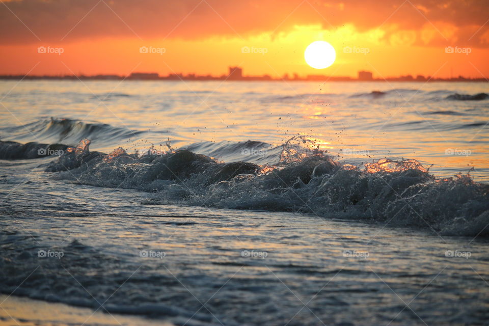 View of a sea wave during sunset