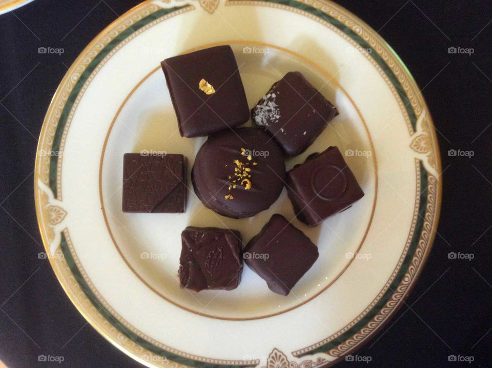 Delicious chocolates on a  plate