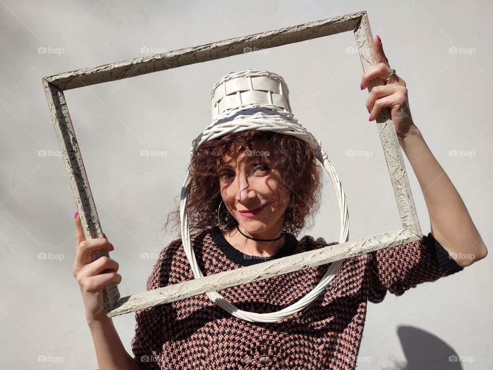 Funny Portrait of Young Woman Posing With Basket on Head, Smiling with Happy Face