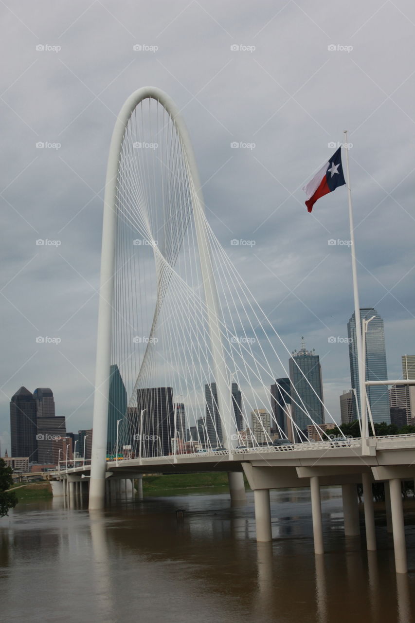 Water under the bridge. Flooded trinity river and continental bridge in Dallas, tx