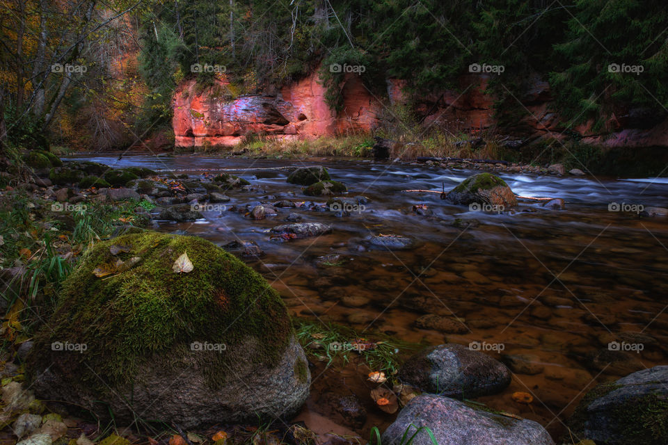 Autumn colors. River. Outdoors. Long exposure.