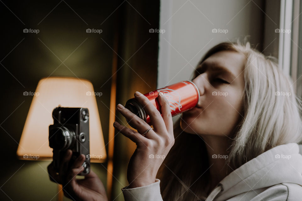 girl with a camera and coca cola