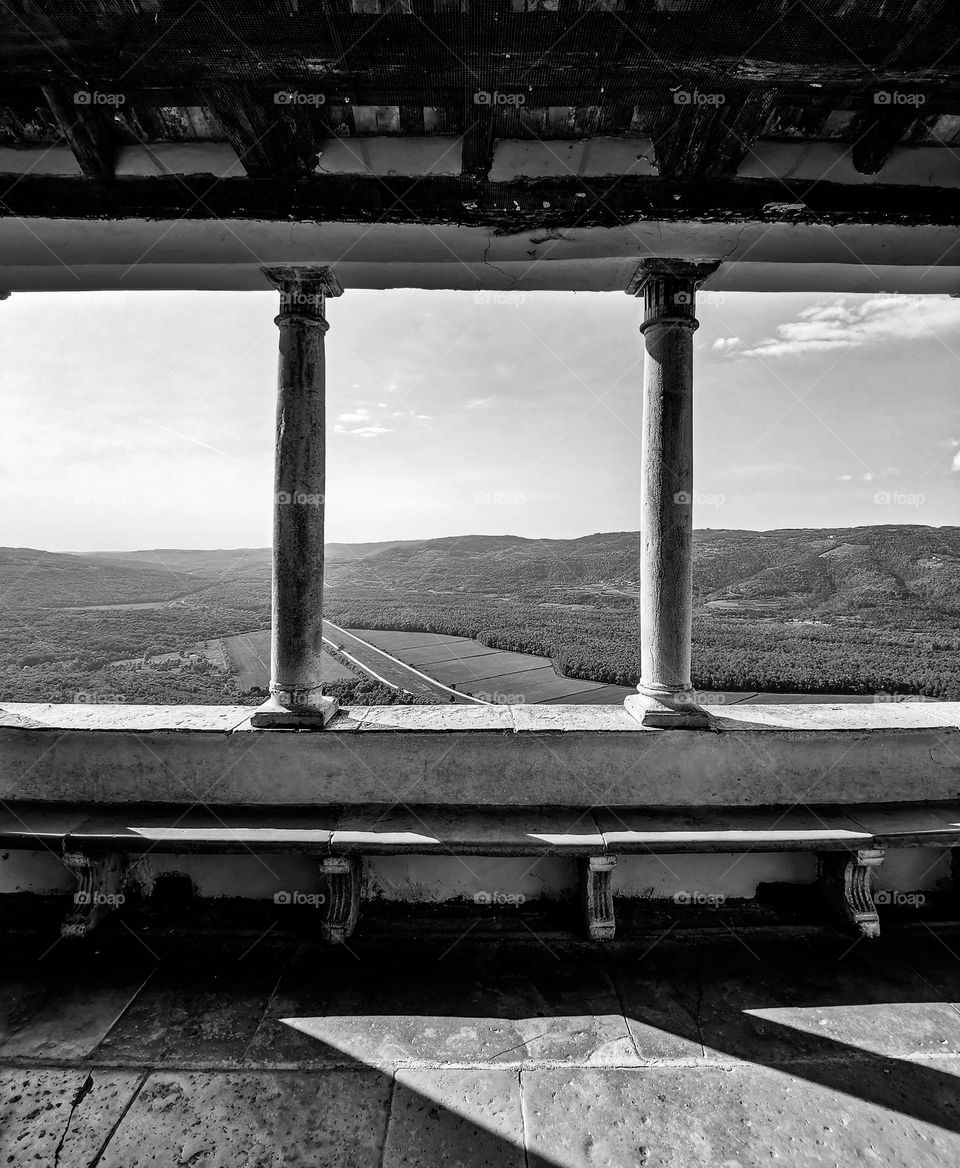 Window with concrete columns on terrace overlooking plains around Grožnjan in central Istria in Croatia