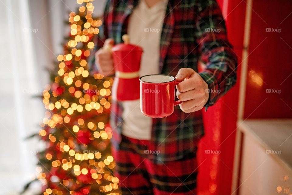 cup of coffee in a cozy festive Christmas atmosphere